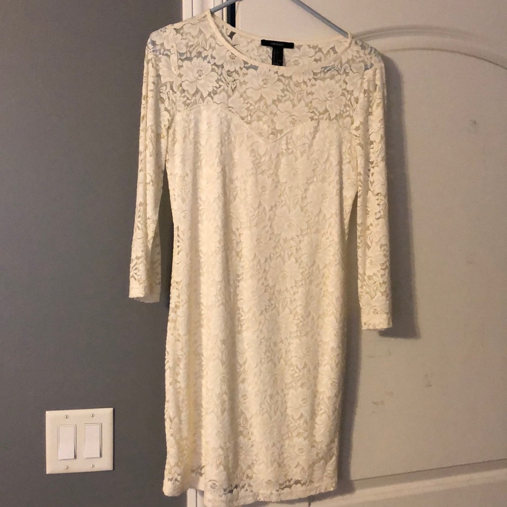 Mini bodycon fit dress. Worn once.  3/4 sleeve.